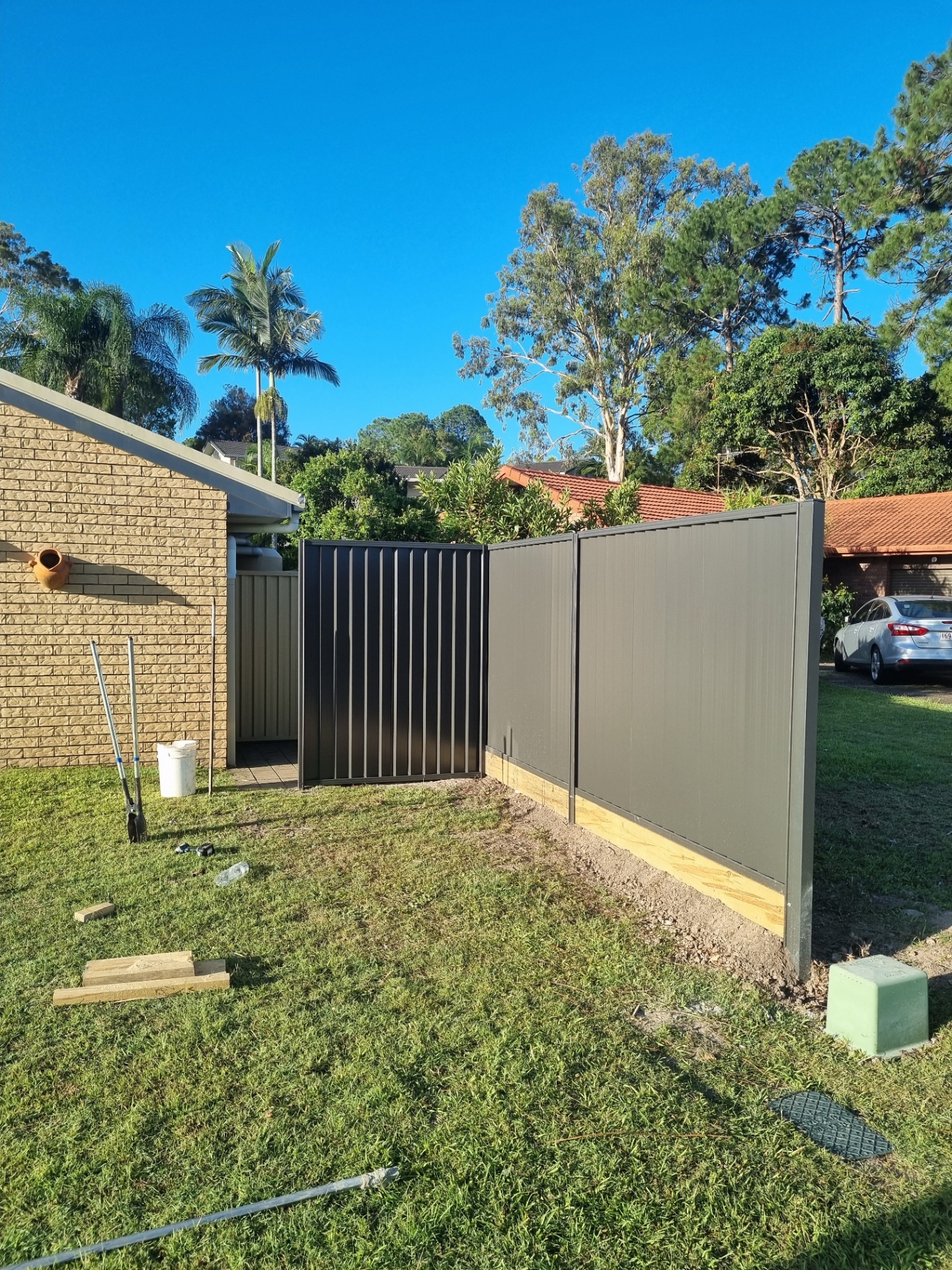 Dark Colorbond fence and gate combination ready for handover.